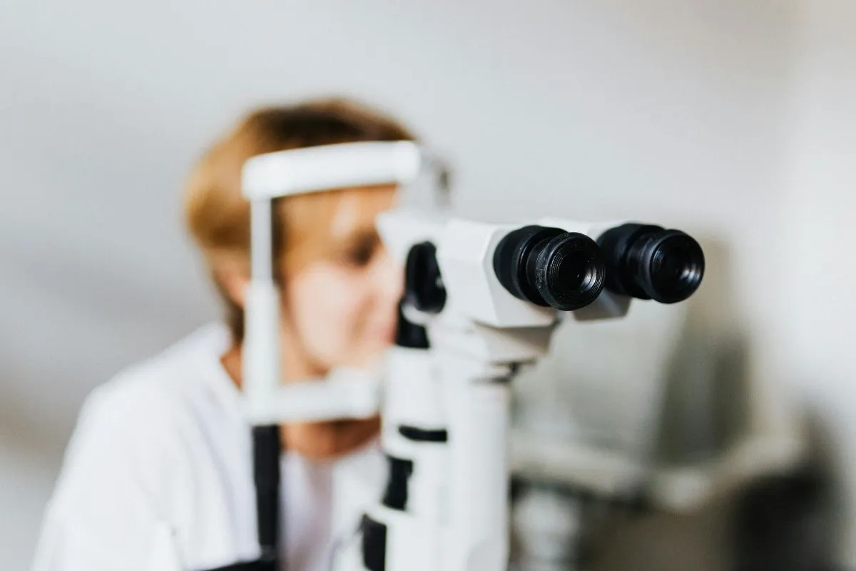 Clinician performing a slit-lamp corneal examination