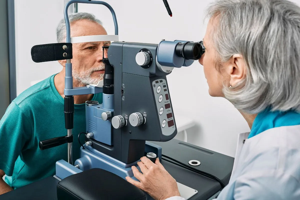 Senior patient having a cataract consultation at the slit lamp